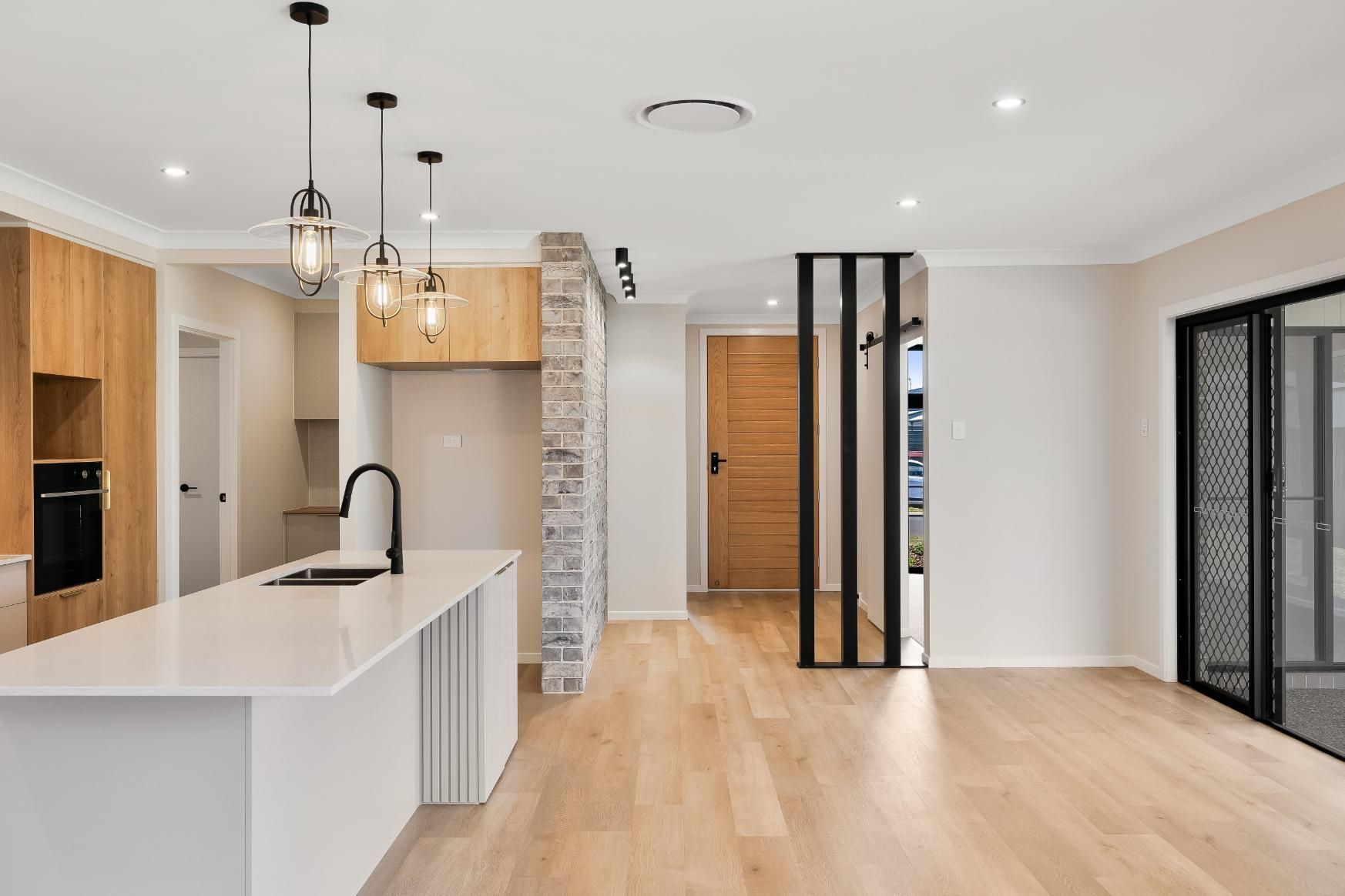 A Kitchen With Doors — Windamere Homes in Highfields, QLD