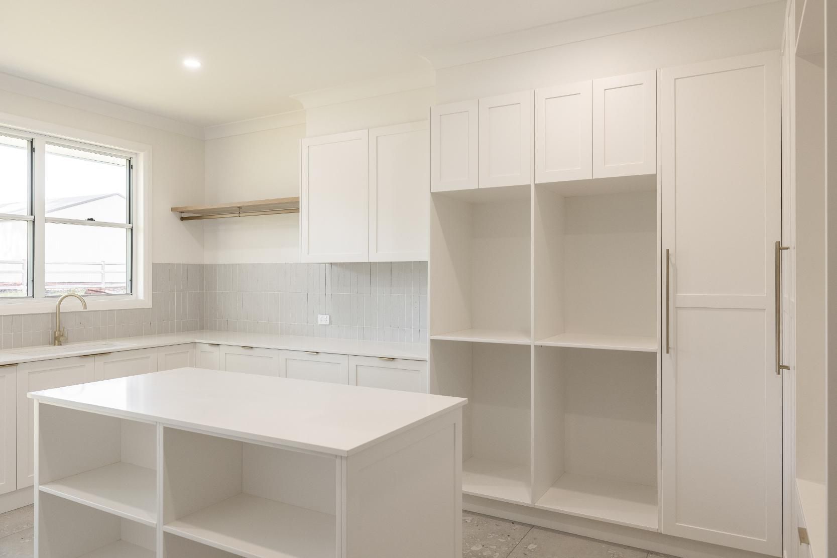 A Kitchen With Cabinets — Windamere Homes in Highfields, QLD