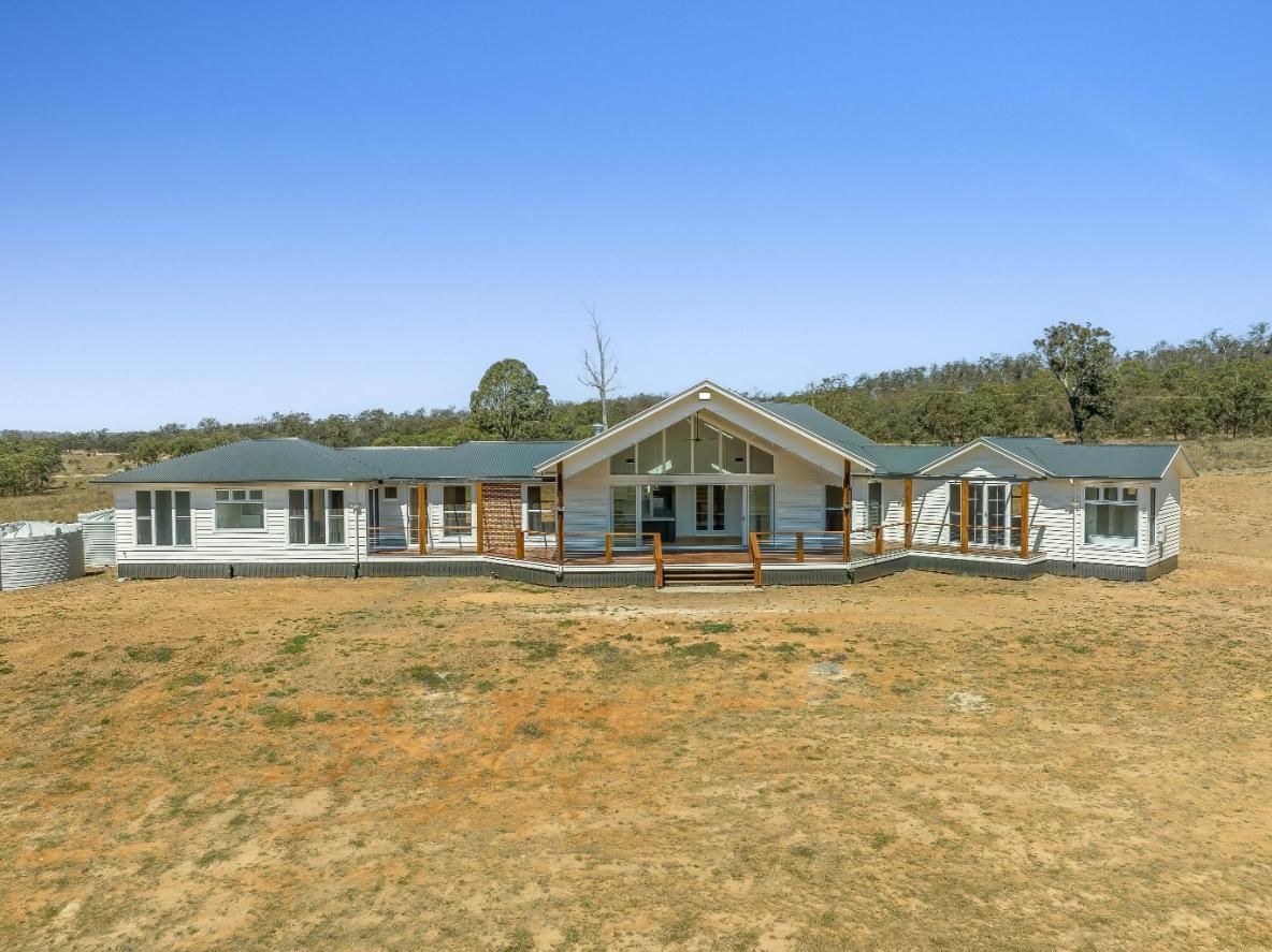 A Large House With a Green Roof and a Field — Windamere Homes in Highfields, QLD