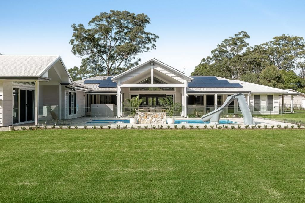 A Large House With a Swimming Pool — Windamere Homes in Highfields, QLD