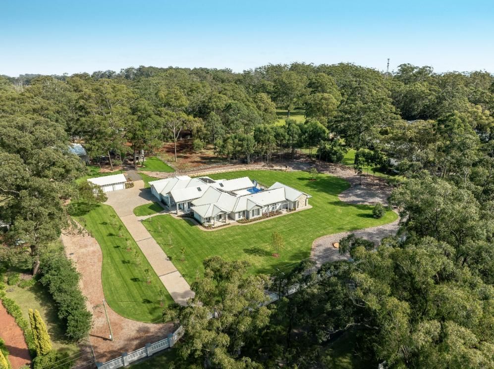 An Aerial View of a Large House Surrounded by Trees — Windamere Homes in Highfields, QLD