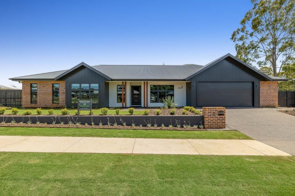 A Large House With a Black Roof — Windamere Homes in Highfields, QLD