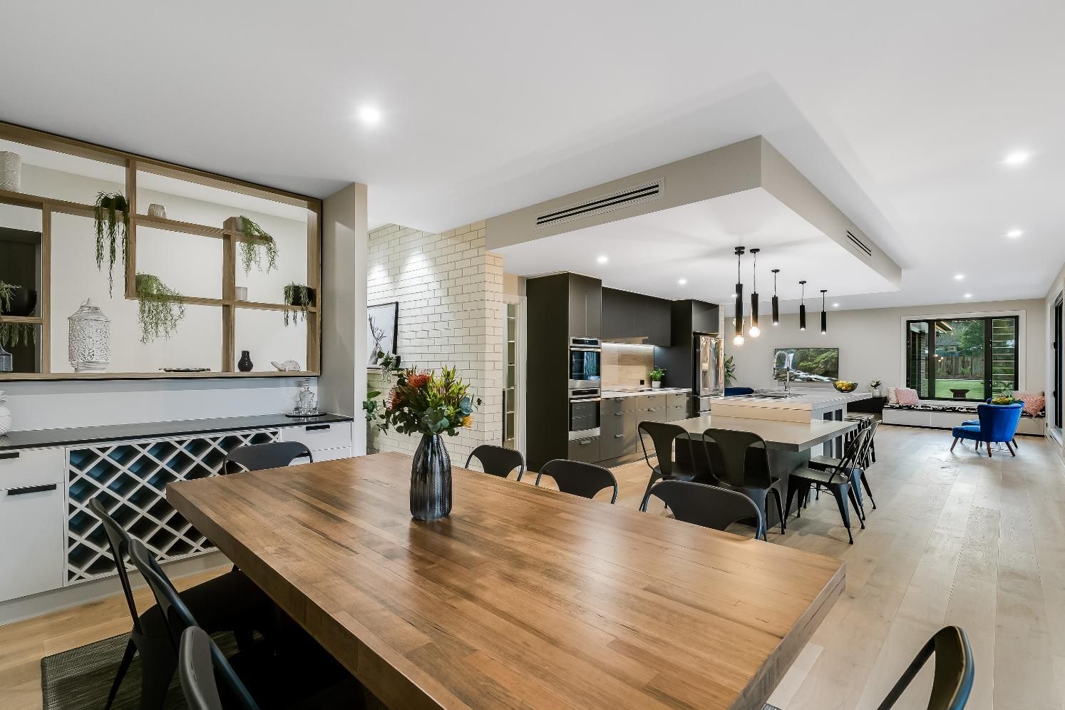 There is a Large Wooden Table — Windamere Homes in Highfields, QLD