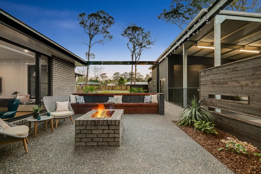 There is a Fire Pit in the Middle of the Patio — Windamere Homes in Highfields, QLD