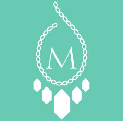 Logo A white necklace with the letter m on it