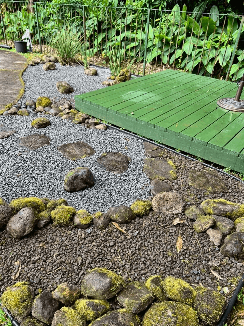 a gorgeous natural wood fence installed next to a concrete pool deck in hawaii