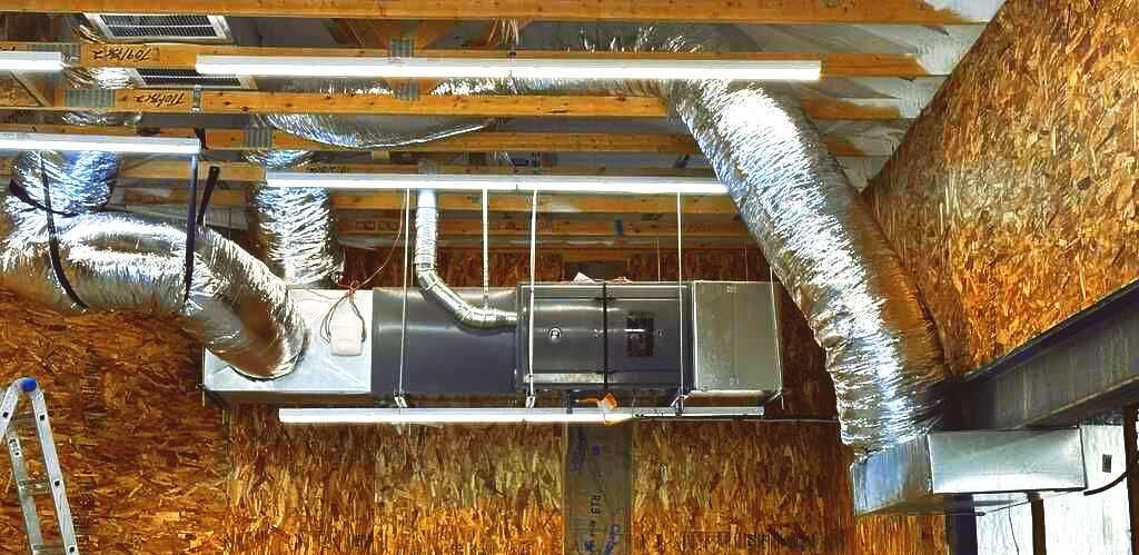 Three men are posing for a picture in a room