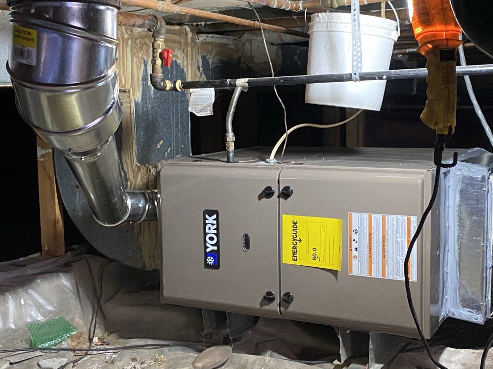 A york air conditioner is being installed in a basement.