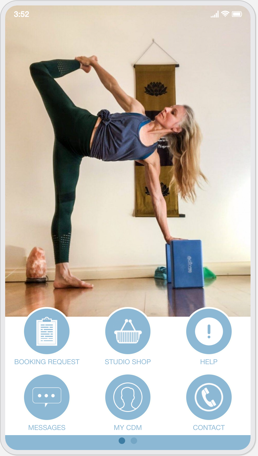 A woman is doing a yoga pose on a block.