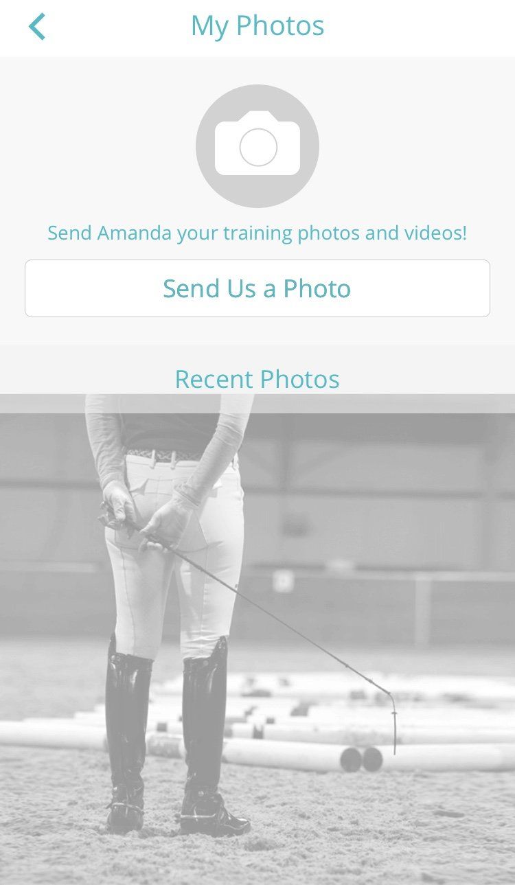 A black and white photo of a horse riding instructor holding a whip.