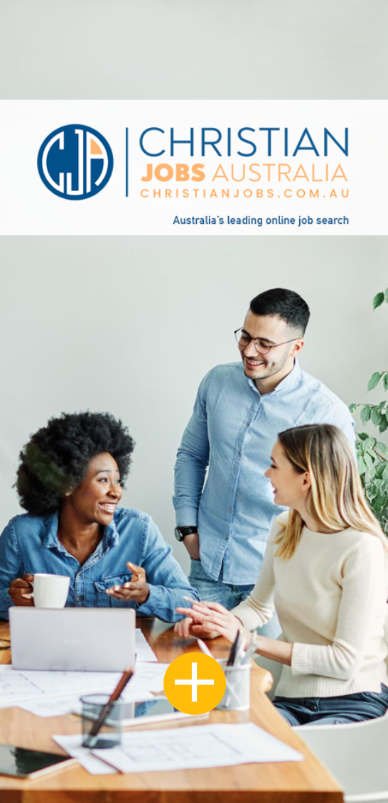 A group of people are sitting around a table having a meeting.
