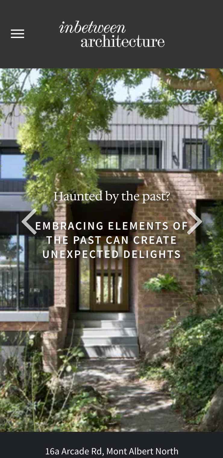 A screenshot of a website showing a house with trees in front of it. inbetween architecture website