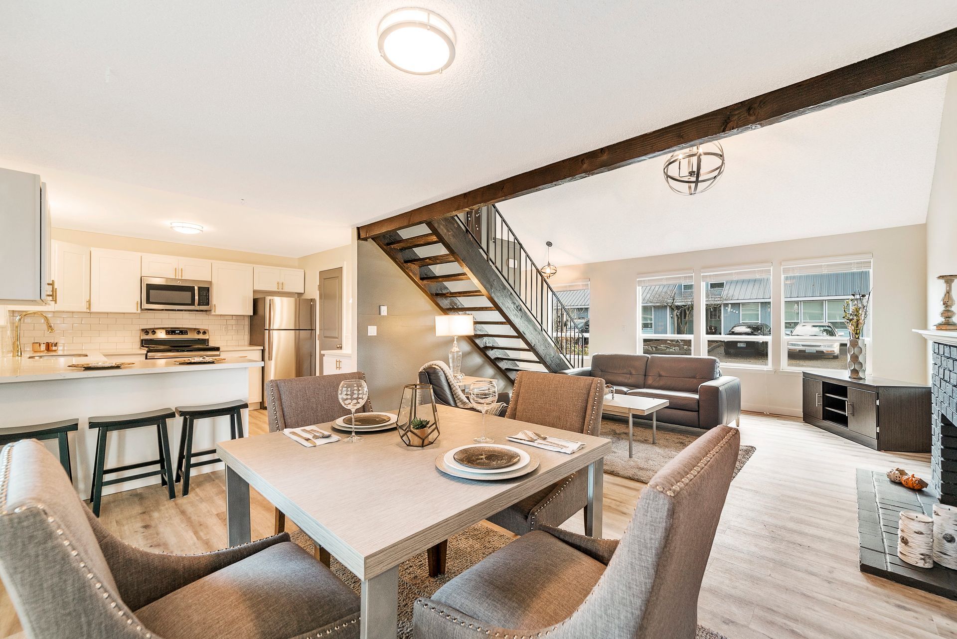 There is a dining table and chairs in the middle of the room.