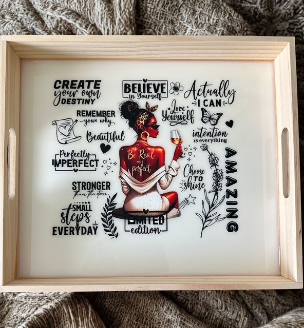 A wooden tray with a picture of a woman on it