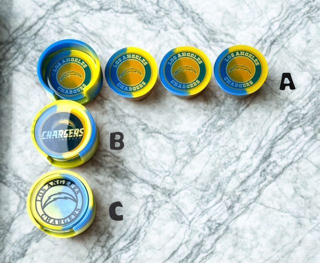 A bunch of los angeles chargers coins on a table