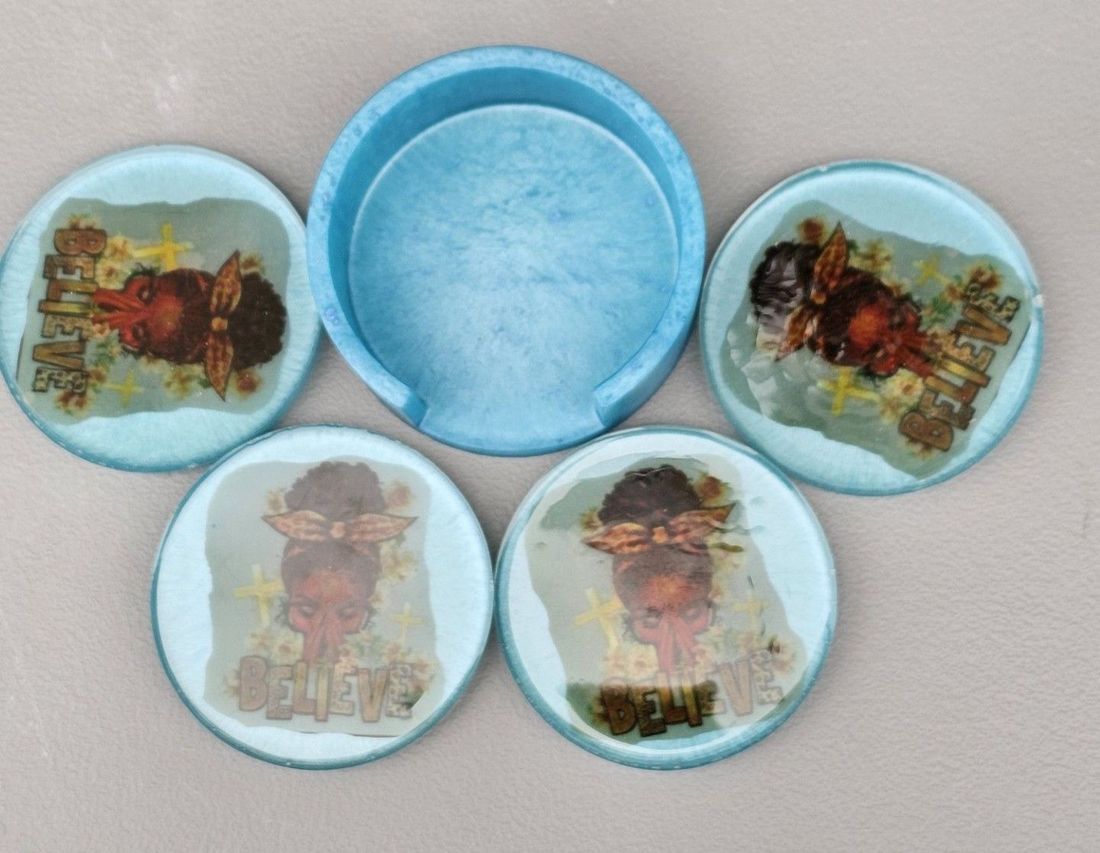 A set of four coasters with jesus on them