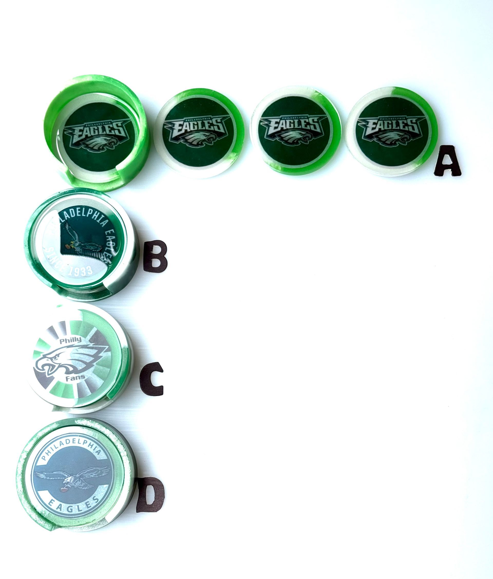 A row of green bottle caps with the eagles logo on them