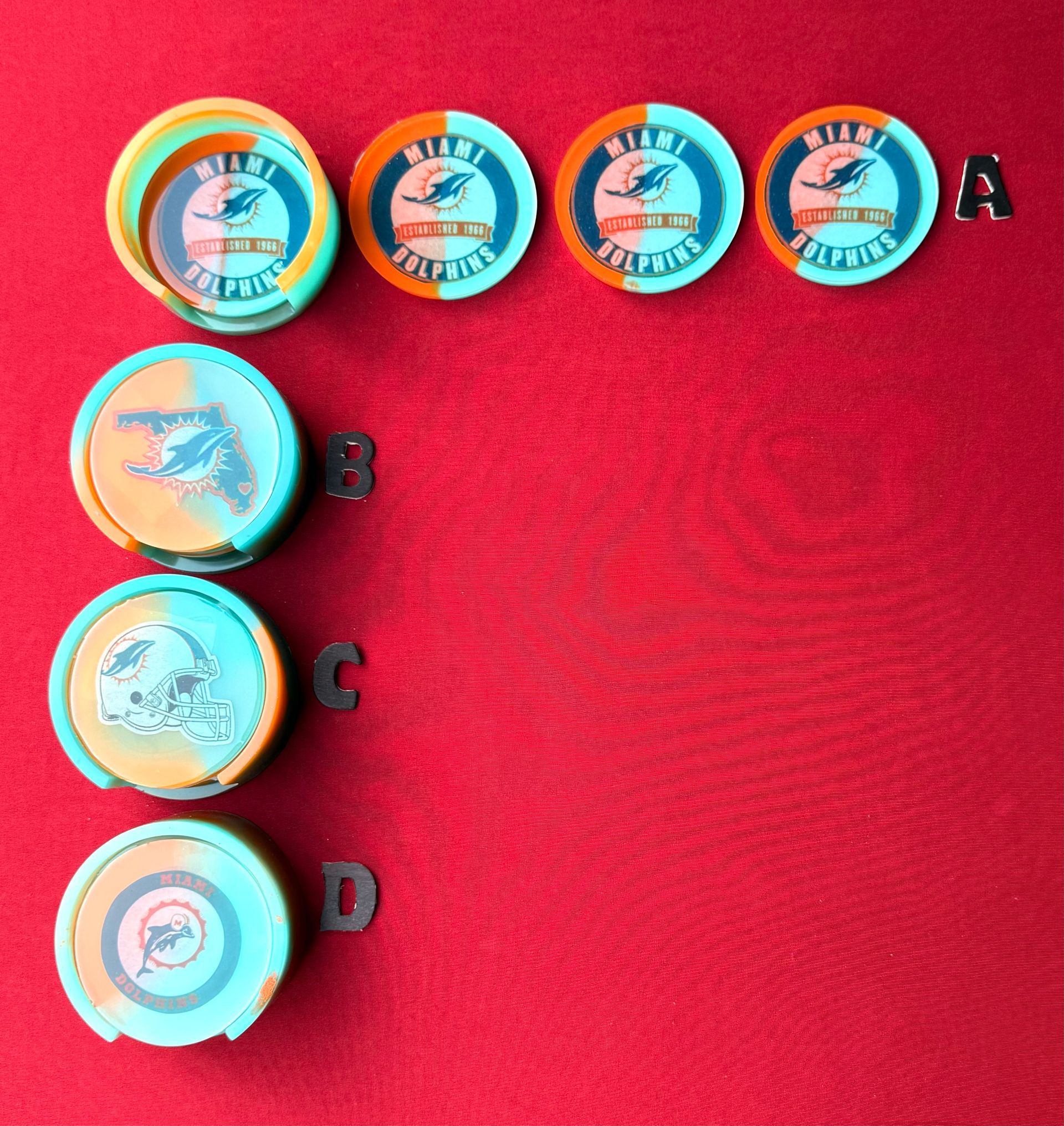 A row of poker chips with the letters a b c and d on them