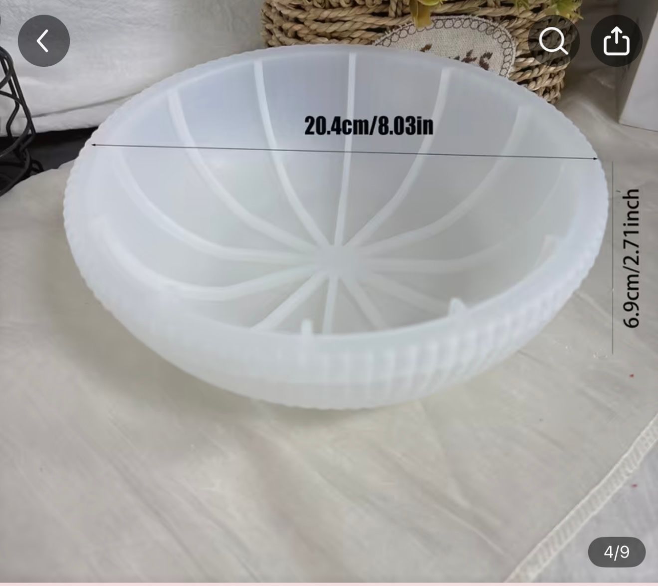 White, translucent, spherical mold with radiating lines for crafts, measuring 20.4cm/8.03in wide and 6.9cm/2.71in deep.