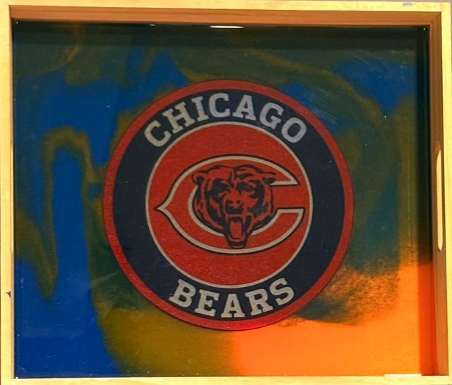 Chicago Bears logo on a tray with blue, orange, and gold background.