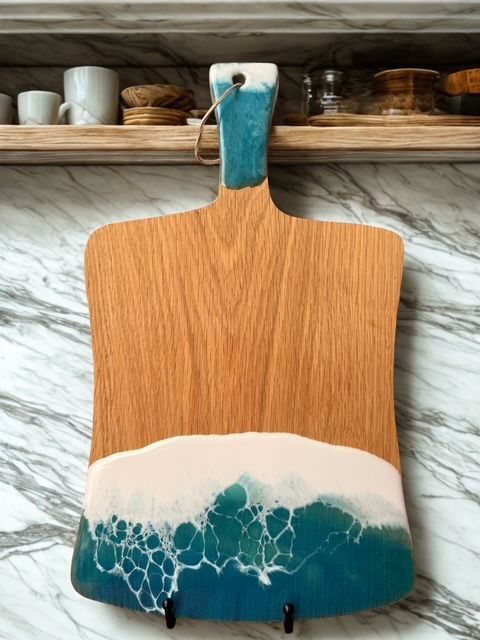 A variety of soaps and candles are sitting on a table.