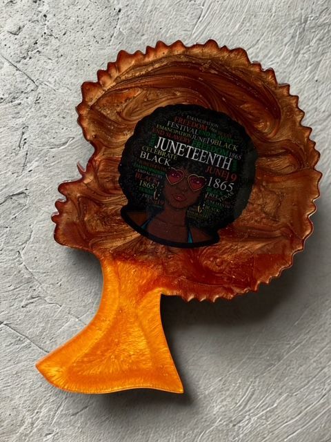 A wooden cutting board with a blue and white design on it is sitting on a table.