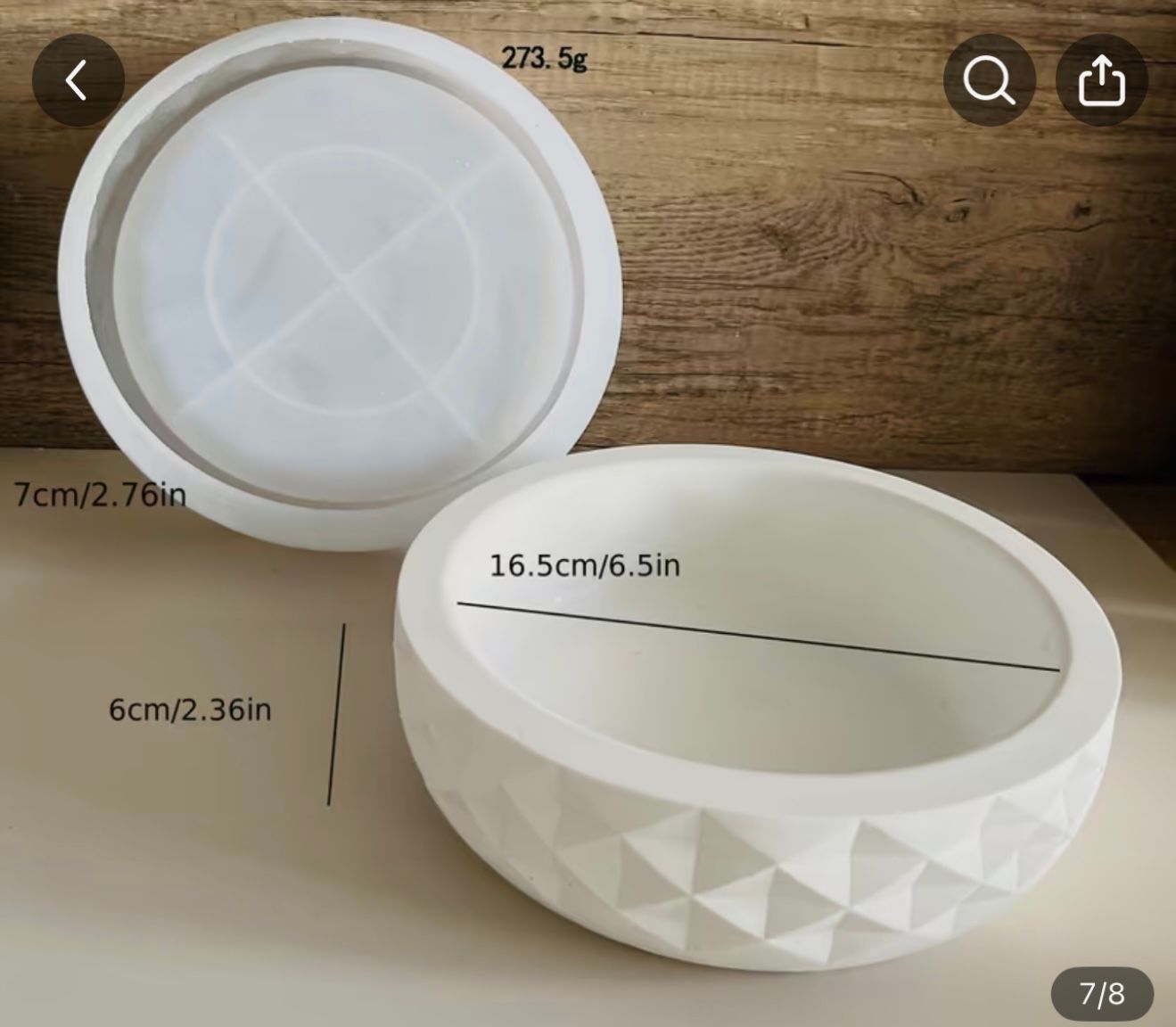 A white bowl with measurements on the side of it