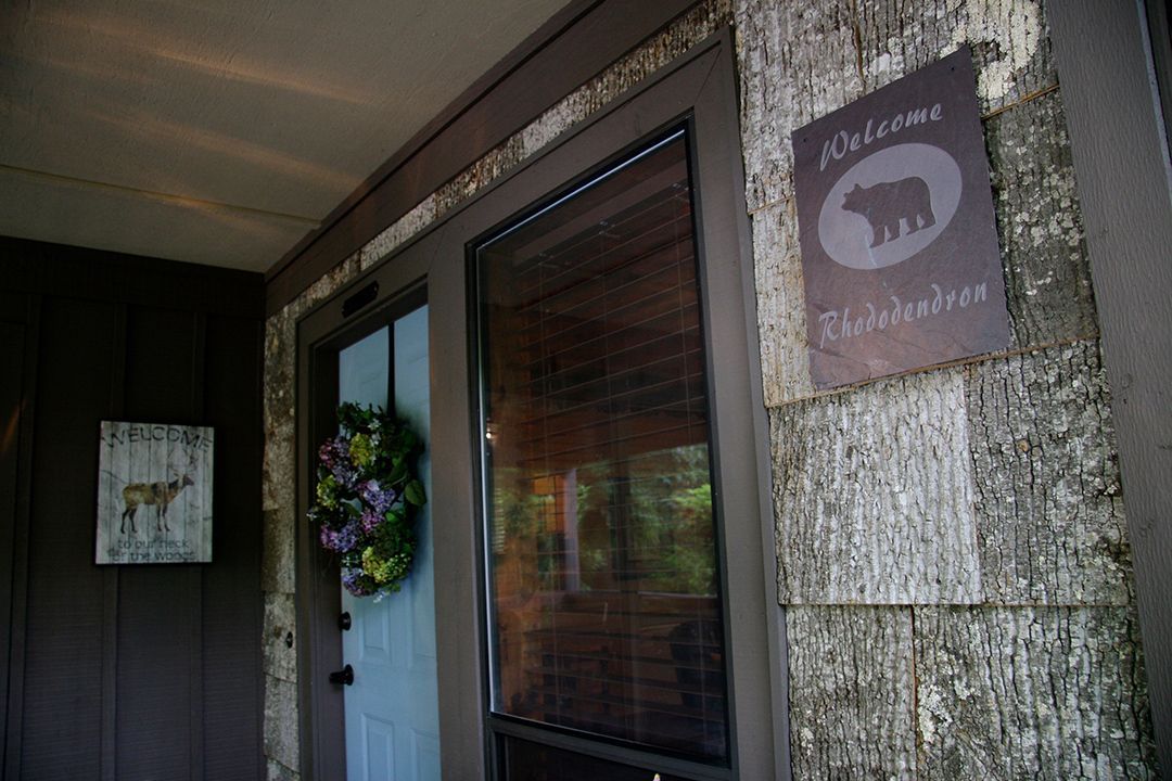 A door with a welcome sign on it and a wreath on it.