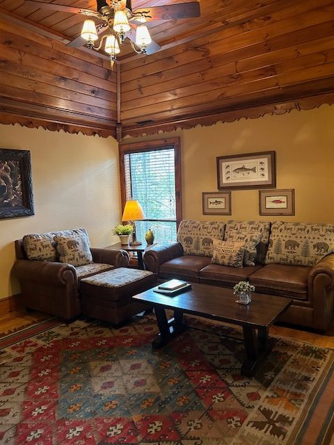 A living room filled with furniture and a ceiling fan