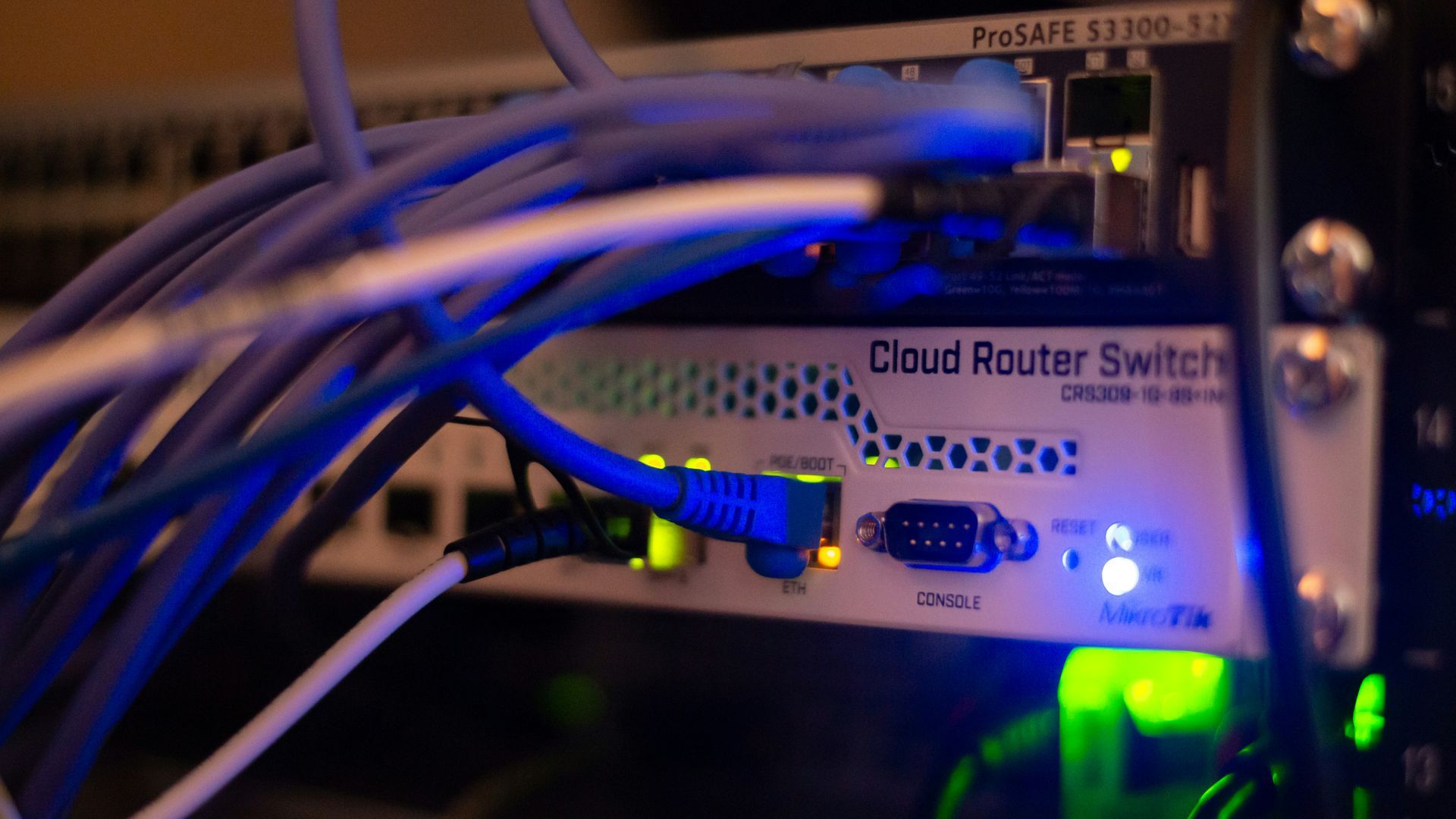 A bunch of wires are connected to a cloud router switch