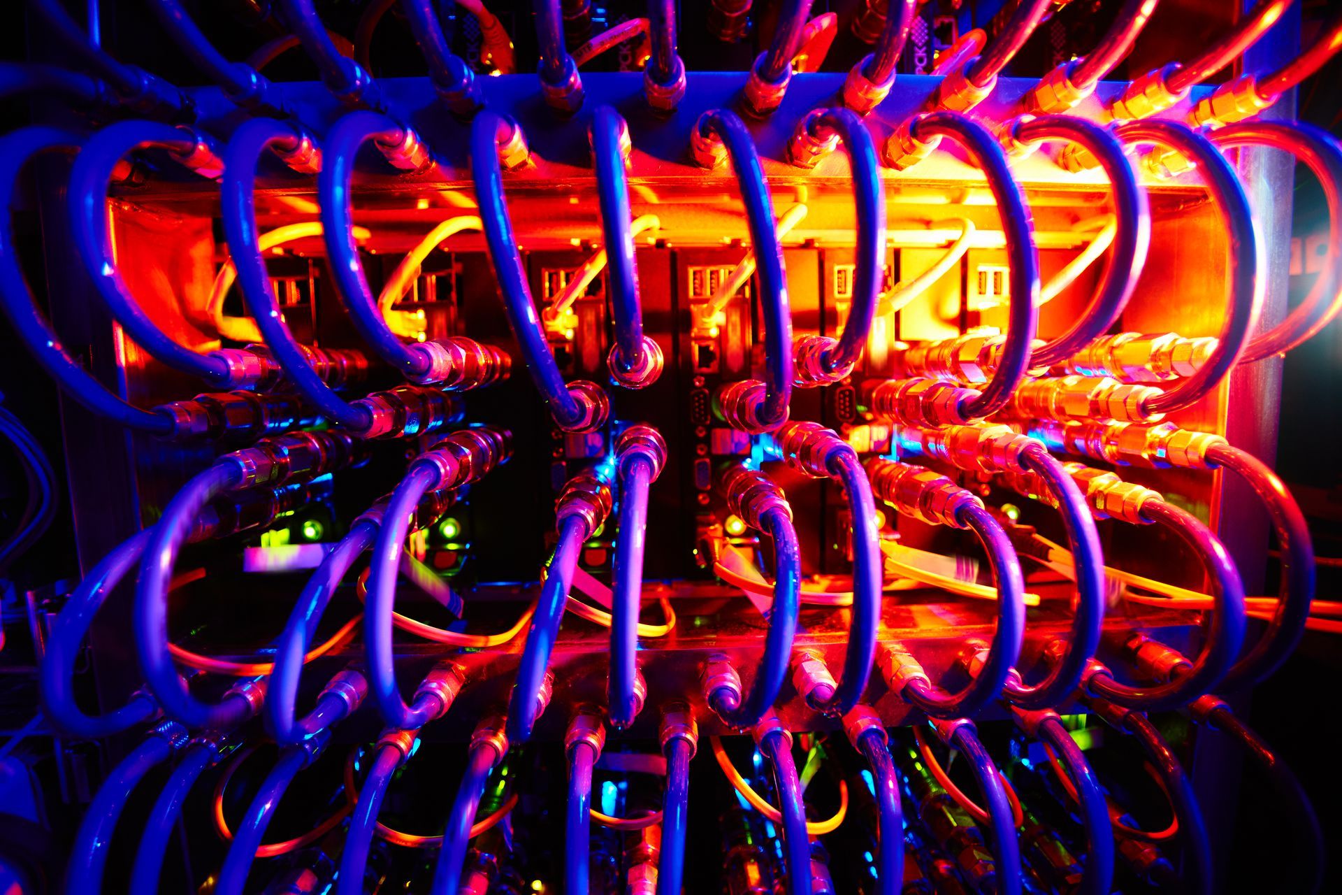 A bunch of wires are glowing in the dark