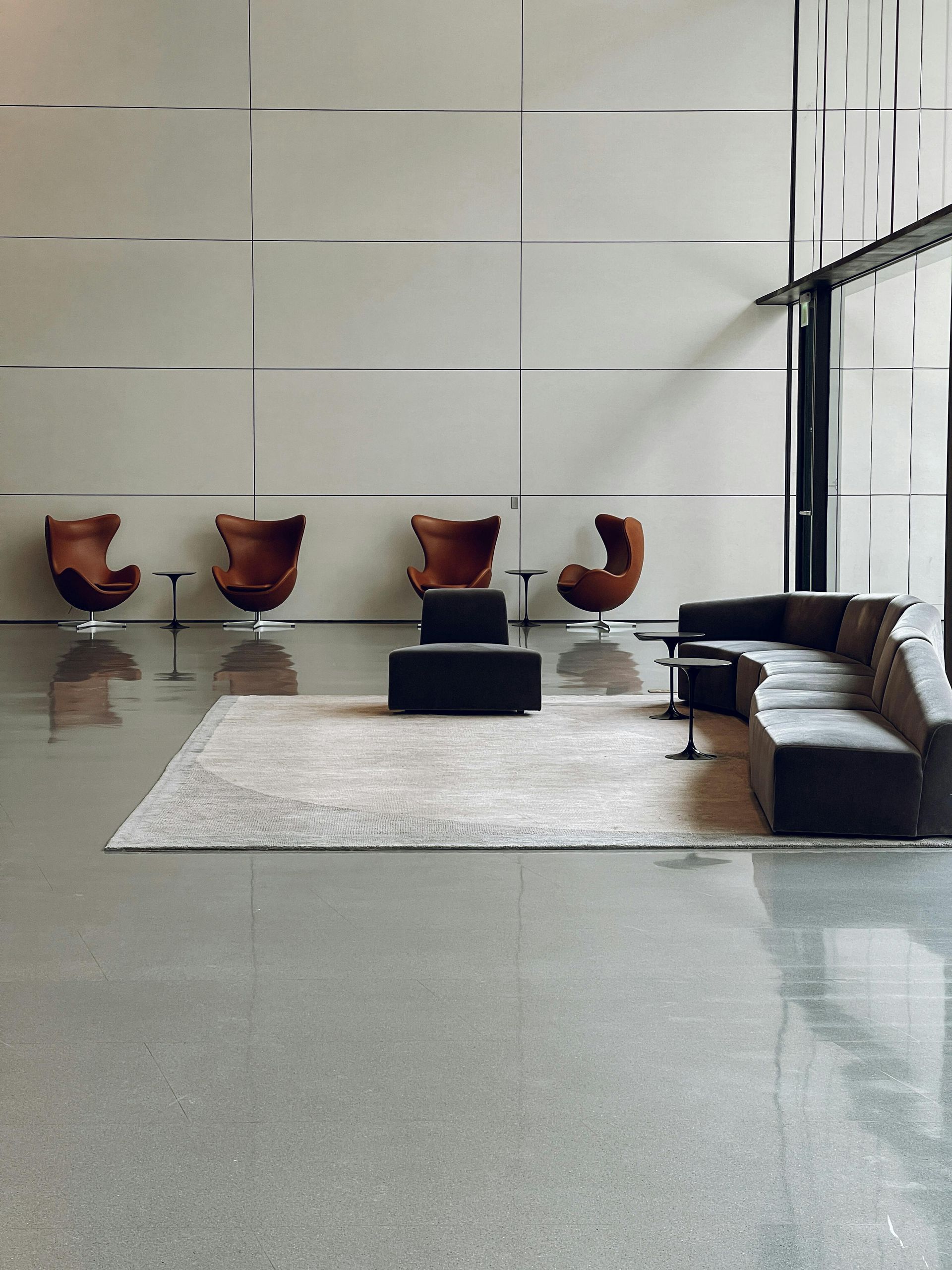 A living room with a couch and chairs in it