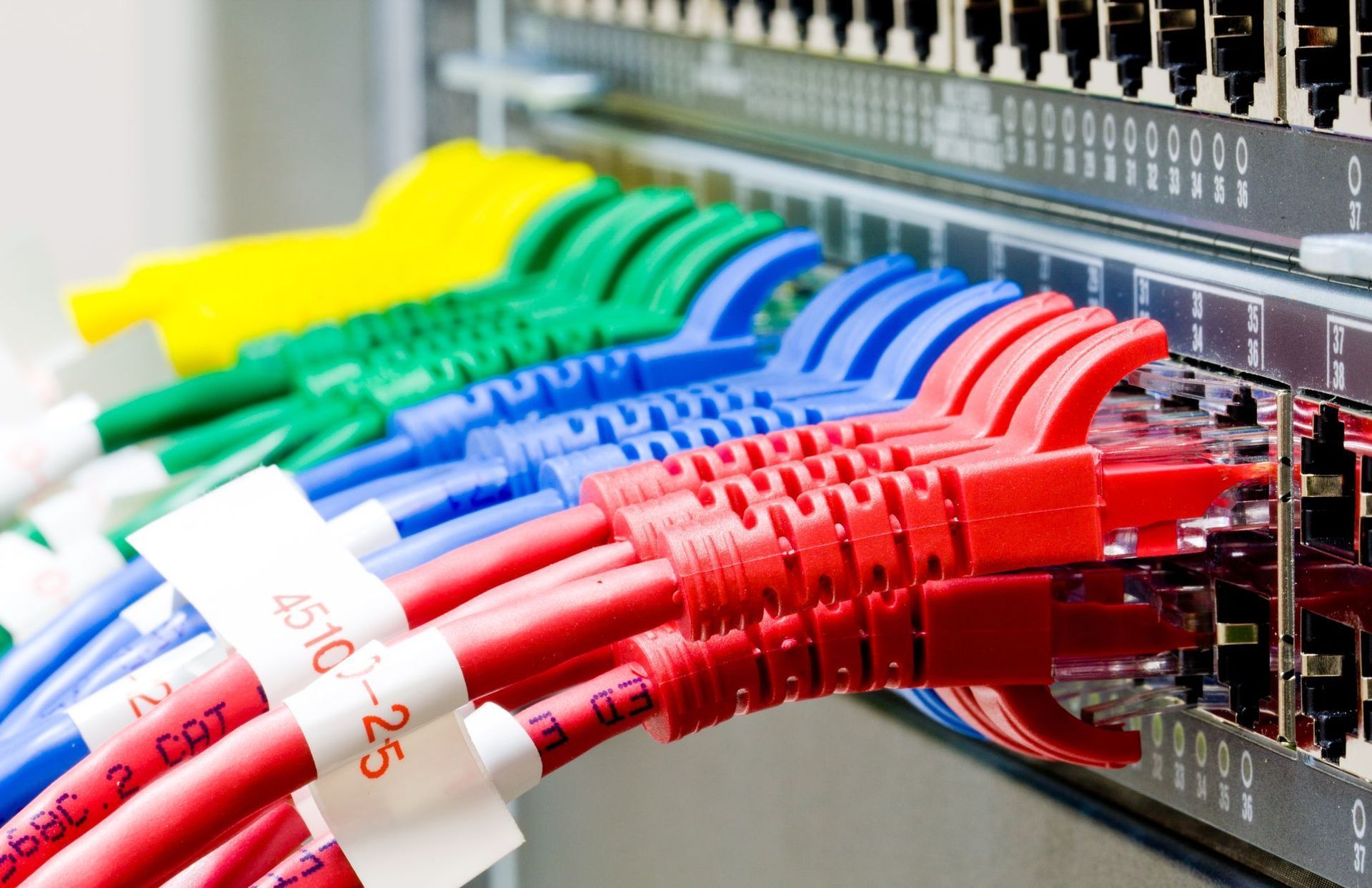 A bunch of colorful wires are connected to a server