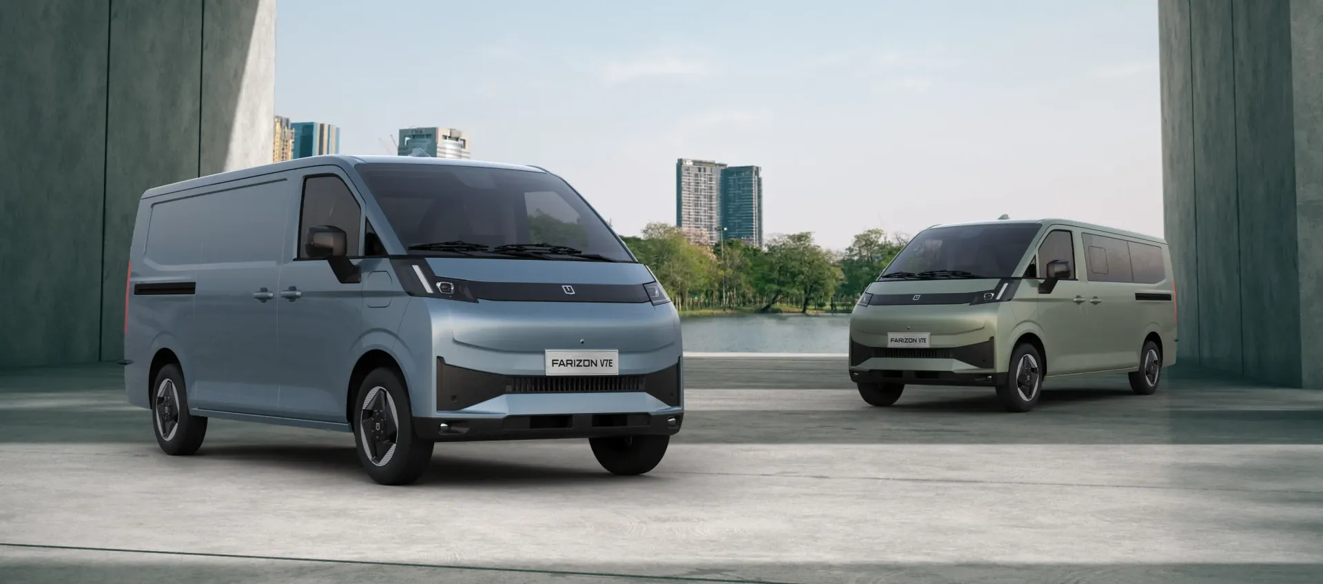 A light blue van and a sage green passenger van parked on a concrete surface against a modern architectural background.