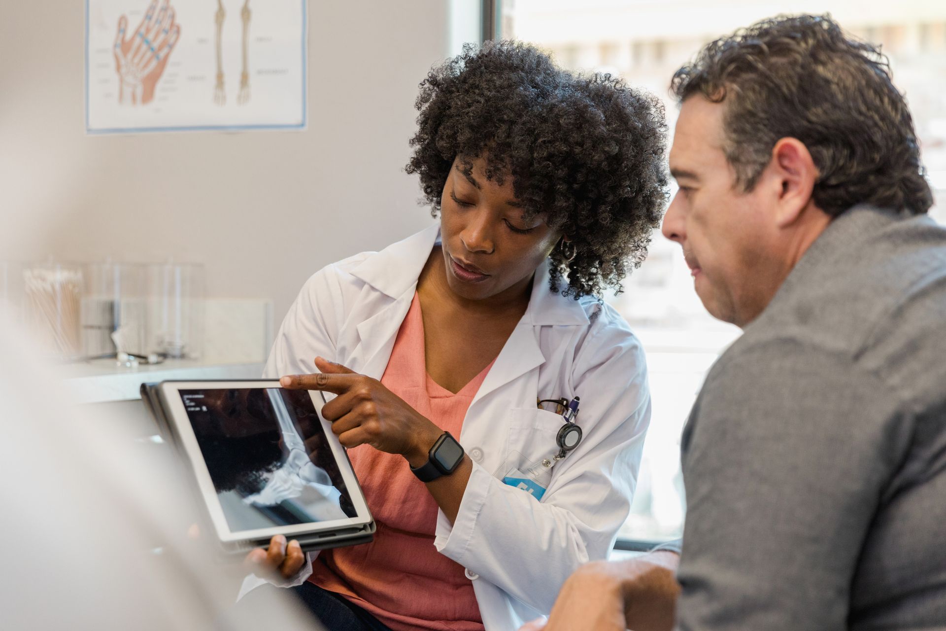 Elevated view of doctor explaining medical scan result