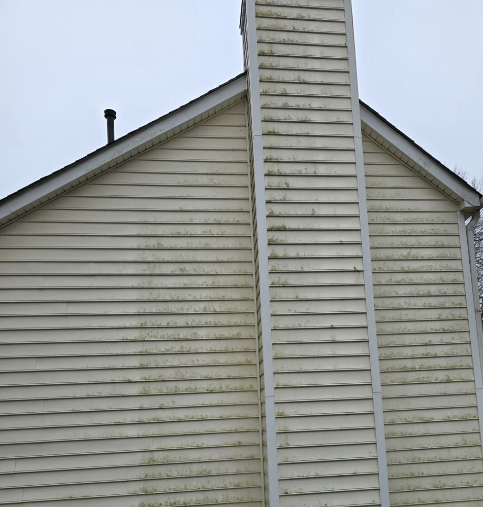 A house with a chimney on the side of it