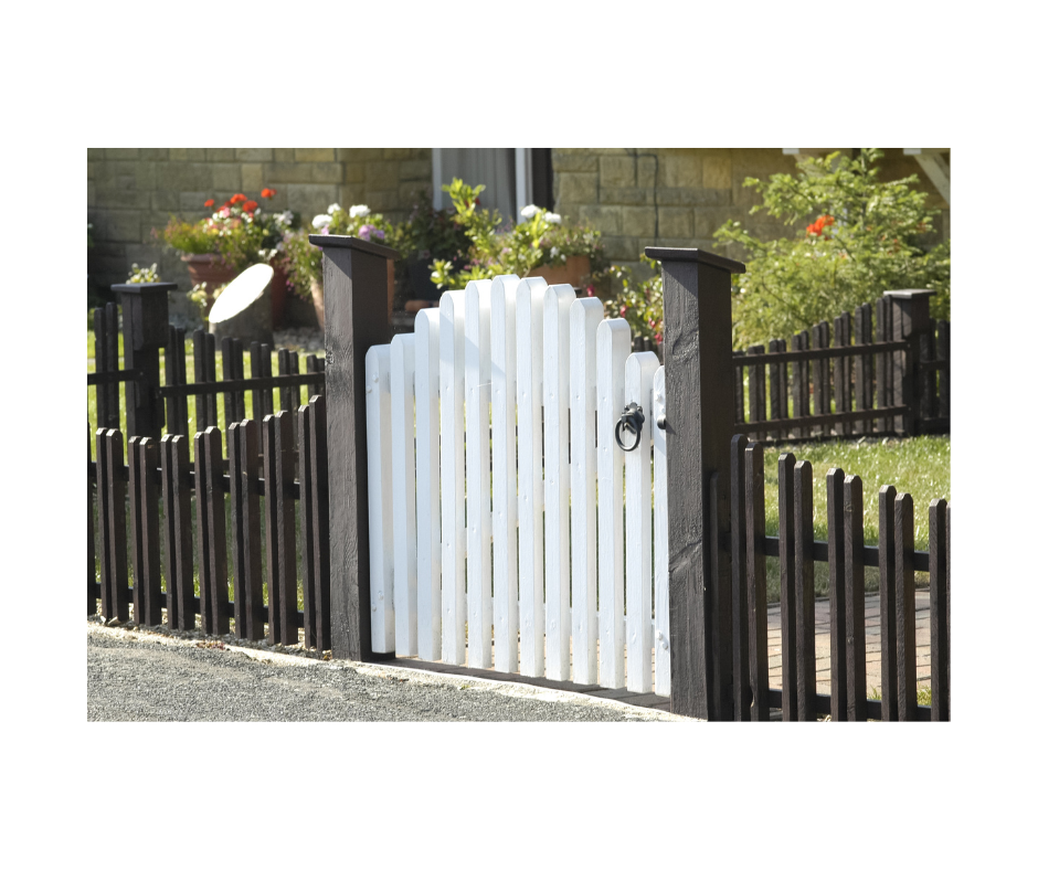 picture of white gate attached to black fence