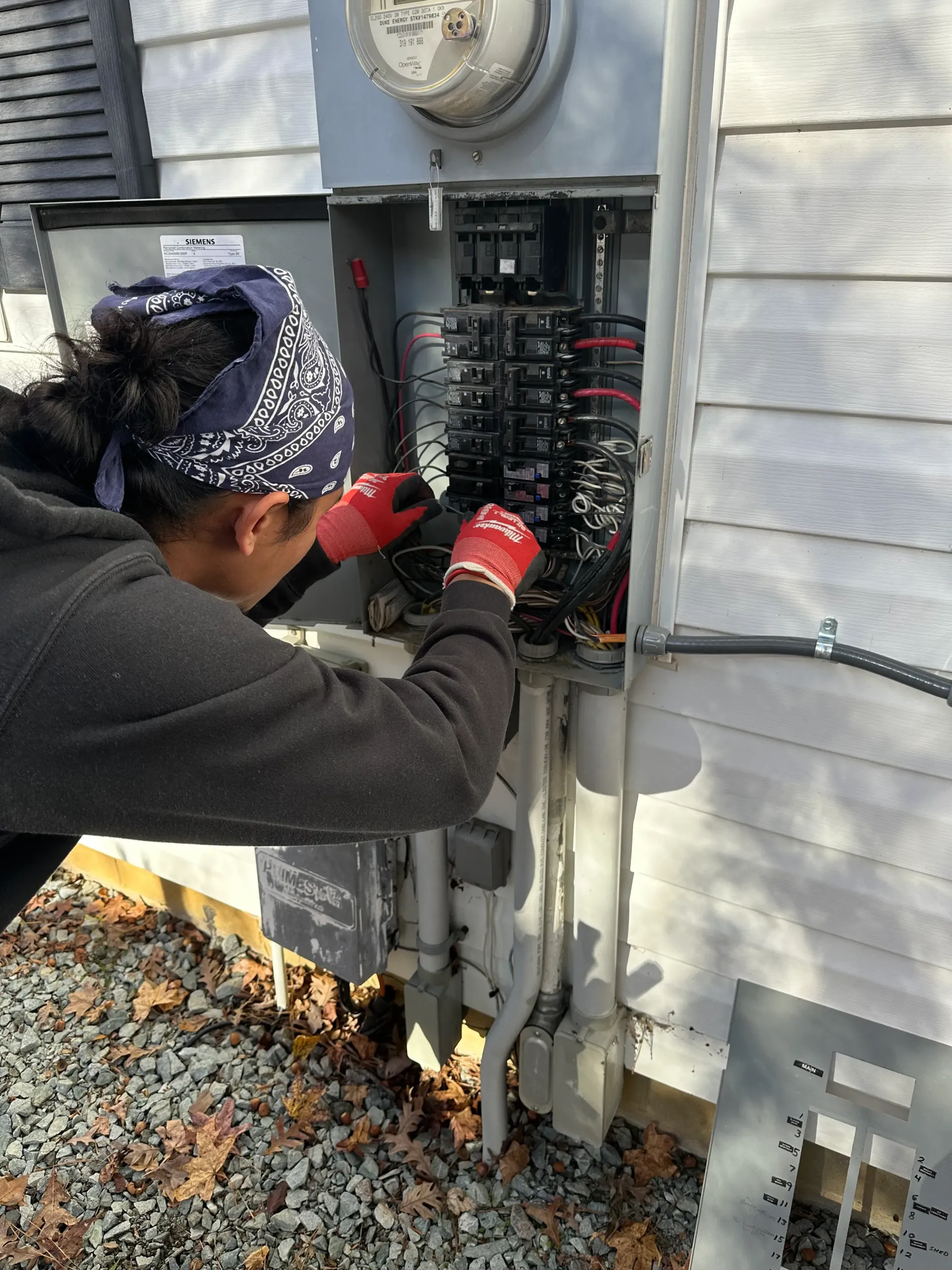 Licensed electrician performing safe panel installation
