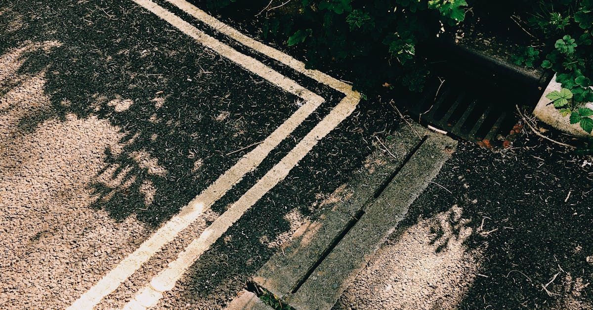 An aerial view of a drain on the side of a road.