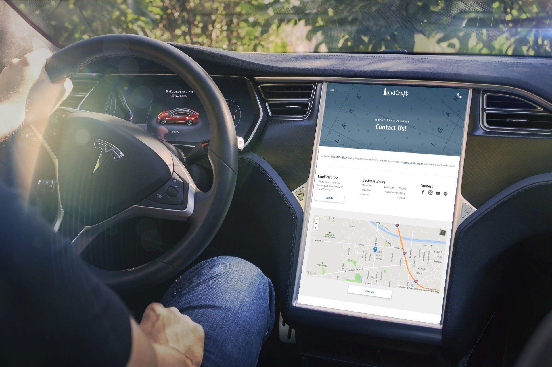 Person in a car with LandCraft website on tablet screen