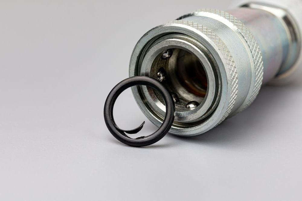 A Close Up Of A Hydraulic Hose Connector With A Black O-ring Attached To It — Torque Tech Supply & Repairs In Taree, NSW