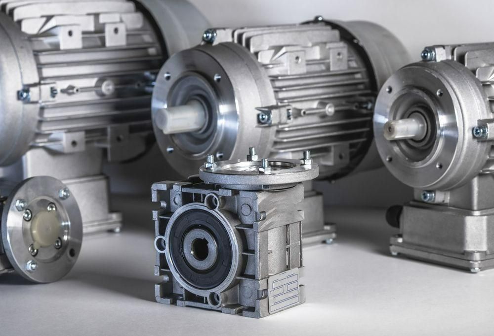 A Group Of Motors Are Sitting Next To Each Other On A Table — Torque Tech Supply & Repairs In Taree, NSW