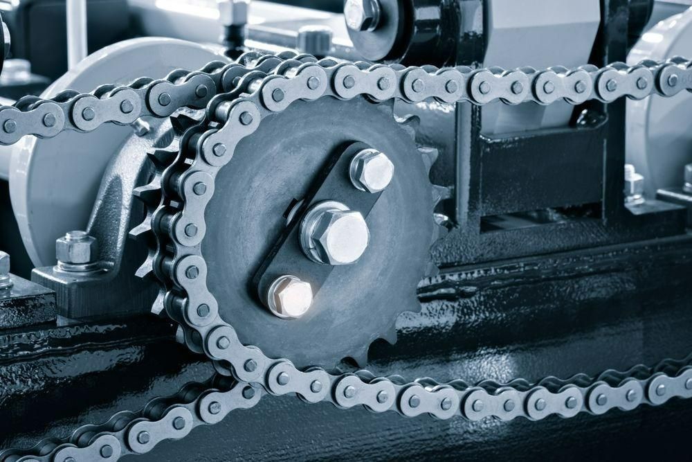 A Close Up Of A Chain And Gear On A Machine — Torque Tech Supply & Repairs In Kempsey, NSW