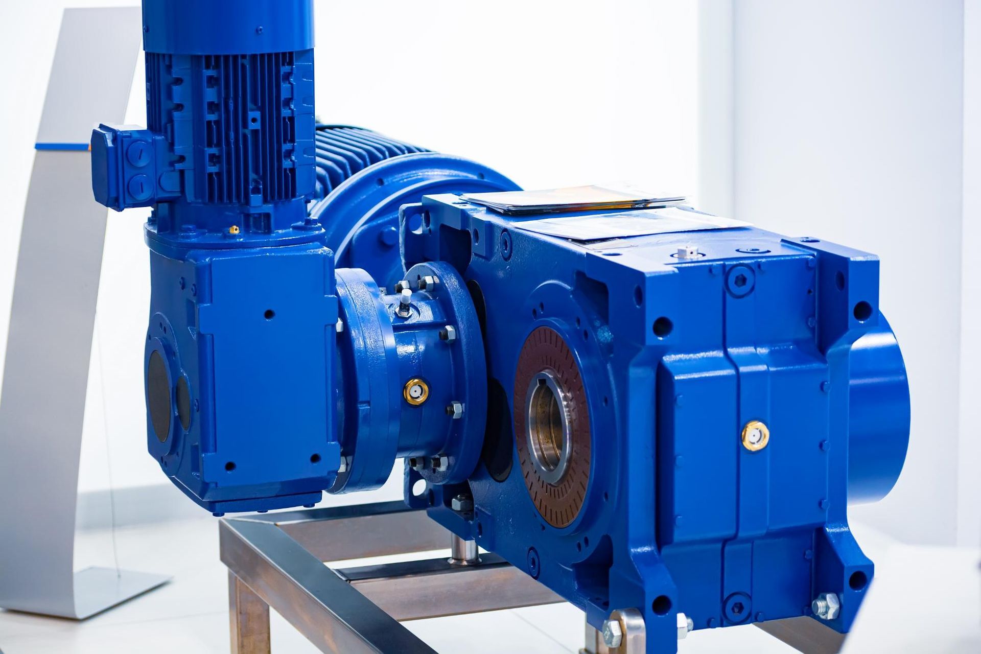 A Blue Gearbox With A Motor Attached To It Is Sitting On A Table — Torque Tech Supply & Repairs In Port Macquarie, NSW