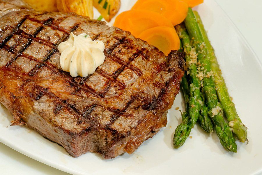 grilled steak with butter and asparagus - Marina Del Rey