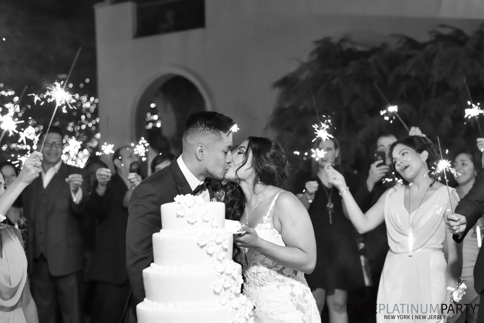 Black & White Groom & Bride Kissing Behind Cake