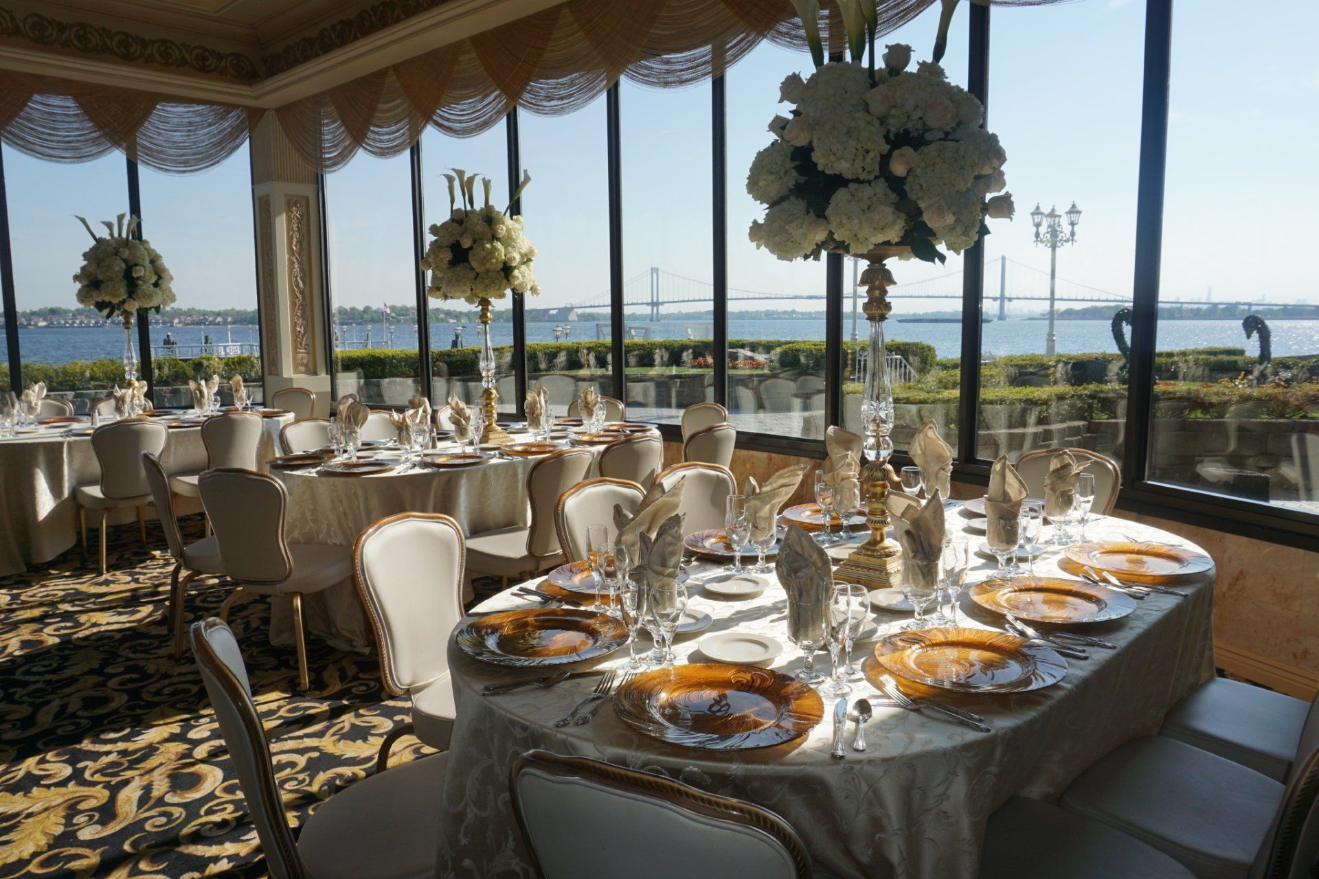 tables set for a wedding with a breathtaking view of the outdoors at Marina Del Rey