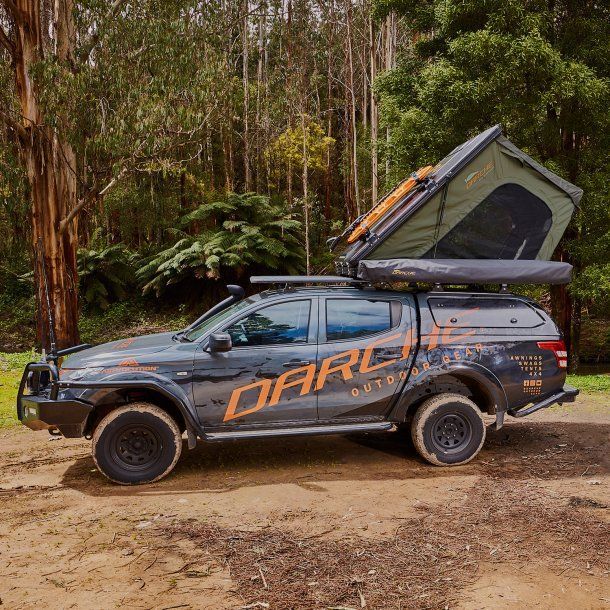 A Truck With A Tent On Top Of It Is Parked On A Dirt Road — Opposite Lock In Wodonga, VIC