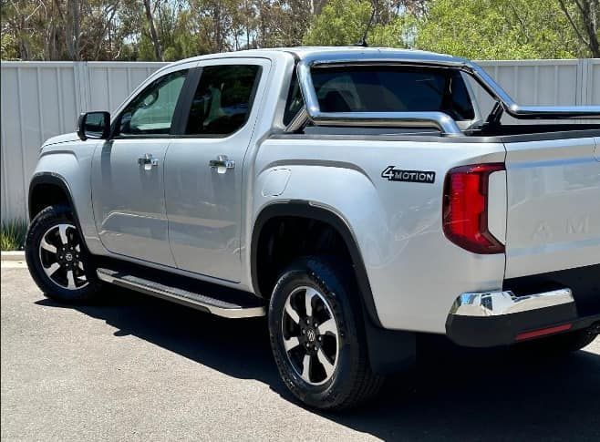 A Silver Pickup Truck Is Parked In Front Of A White Fence — Opposite Lock In Wodonga, VIC