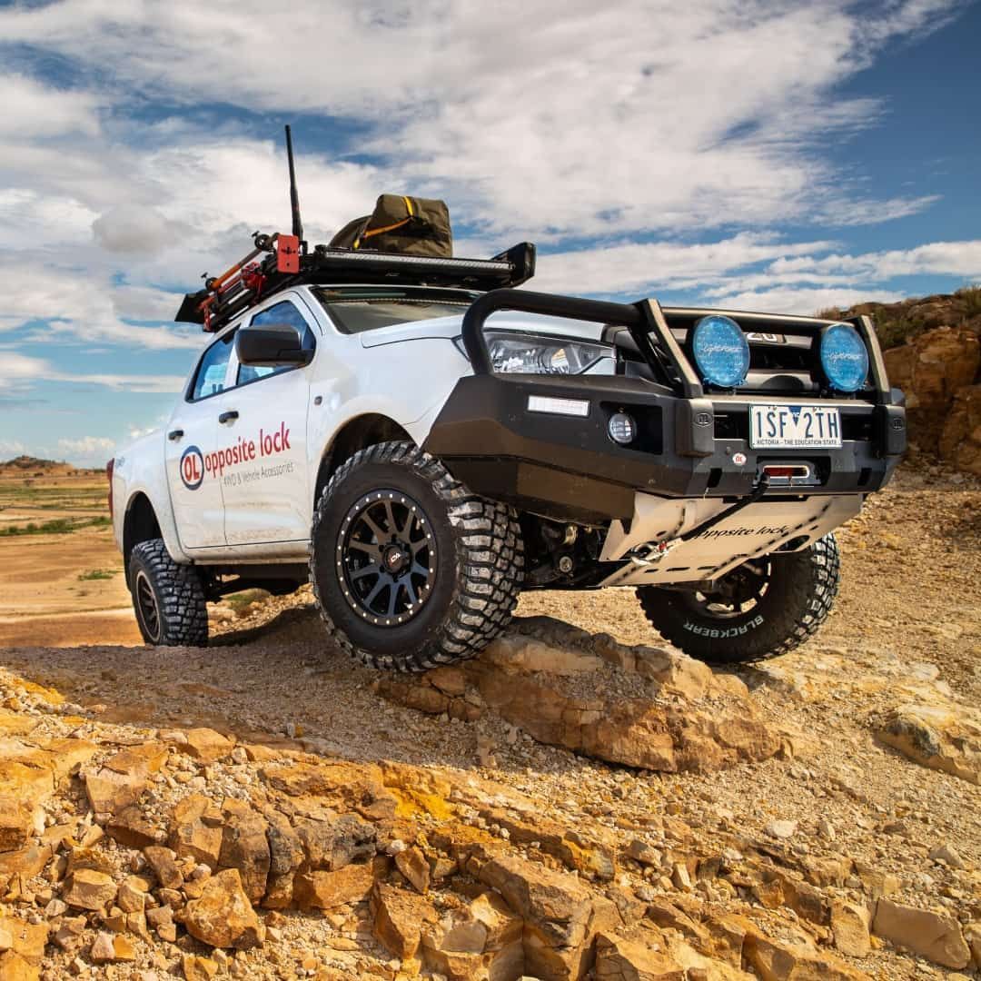 A White Truck Is Driving Down A Rocky Hill — Opposite Lock In Wodonga, VIC